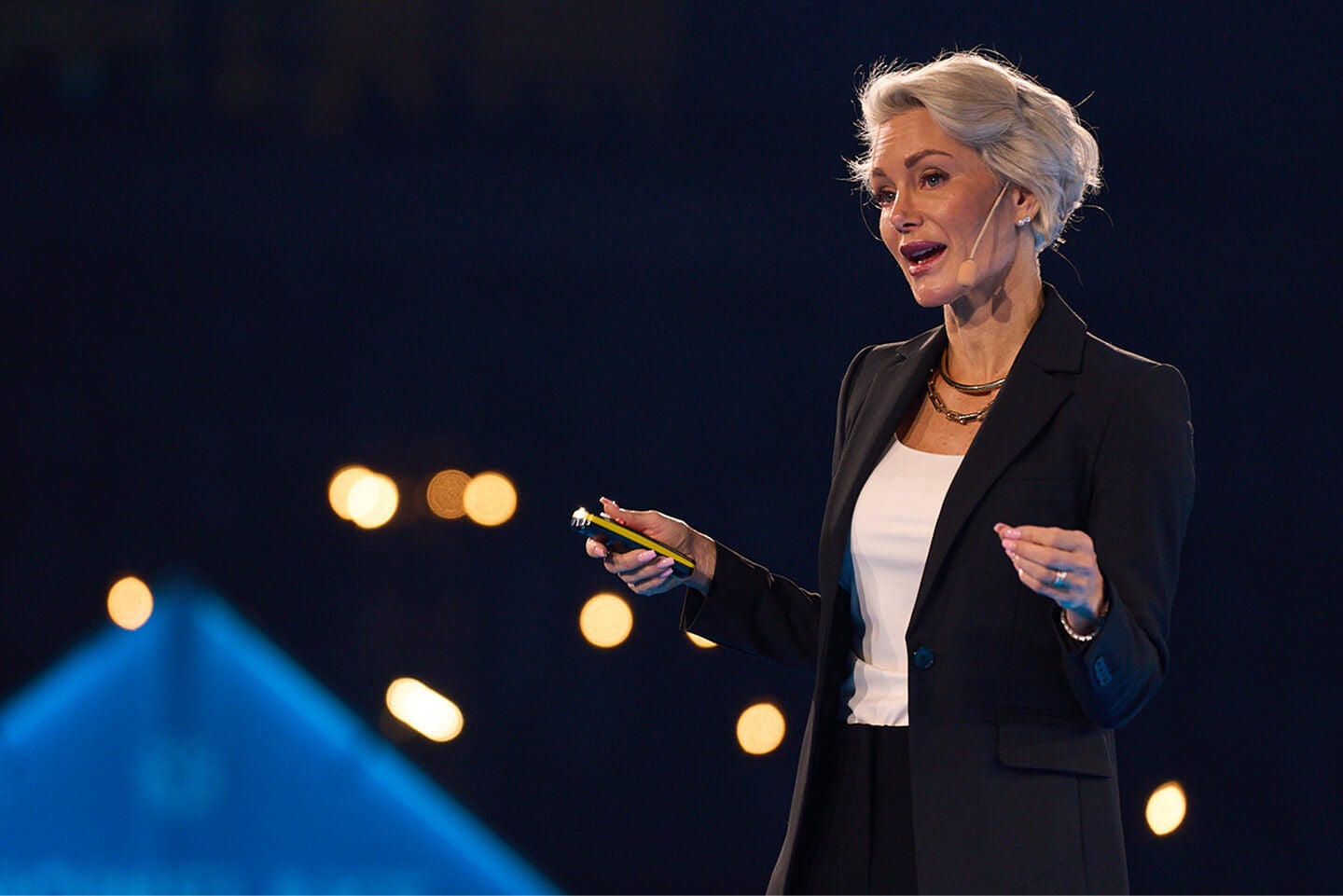 woman speaking on stage